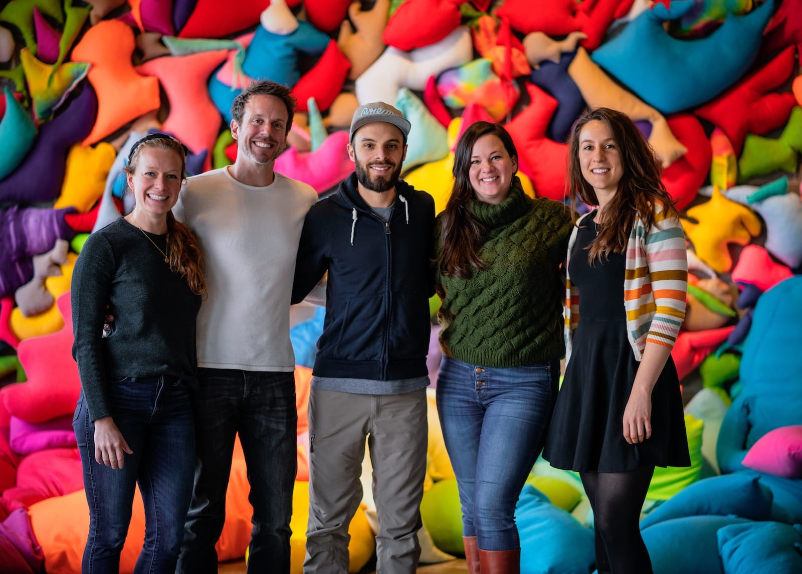 Artwork Archive team members standing in front of an art installation.