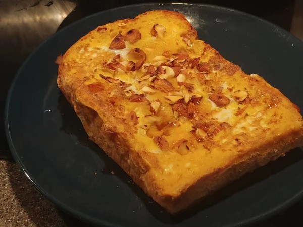 A French Toast Lying on Its Belly by Photography